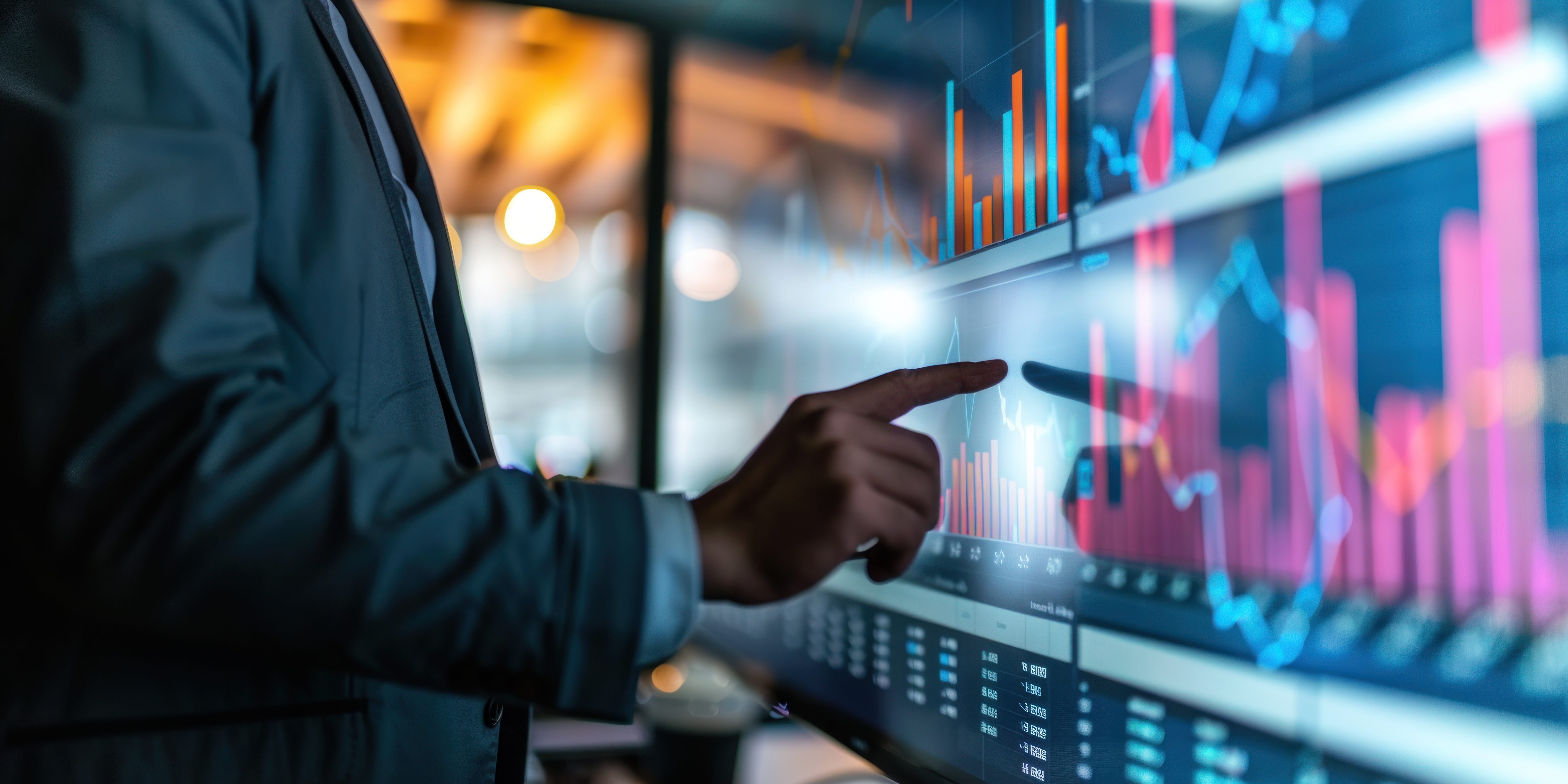 Analyst reviewing data trends on a large interactive dashboard